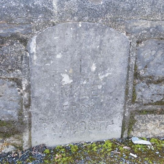 Milestone, Laira Bridge Road, by No. 56 and 58 flats, opp. the rear of Prince Rock Primary School