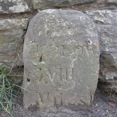 Milestone, by barn at Bache Mill House