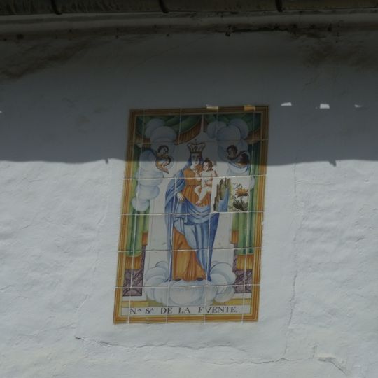 Ceramic panel of Our Lady of the Fountain at 5 Enginyer Roselló street