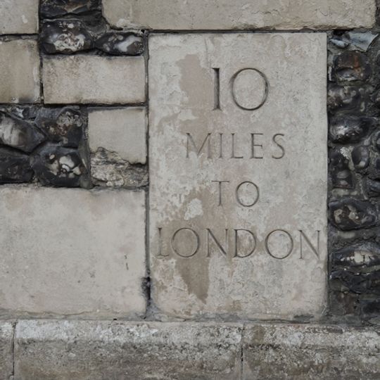 Milestone, High Street, in wall of terrace to War Memorial Building