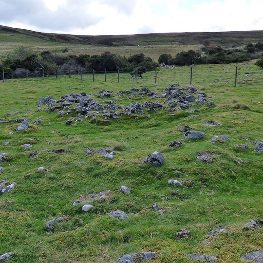 Prehistoric settlements and cairnfield, medieval farmsteads, bloomeries and charcoal pits, 840m south of Cronkley on Bracken Rig