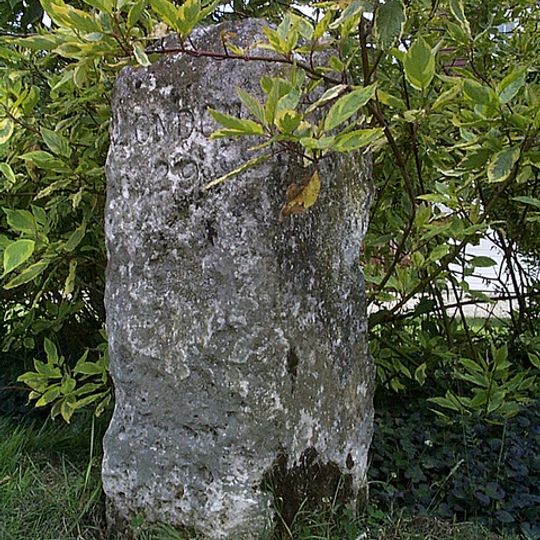 Milestone, roadside at TL72570468