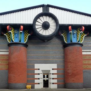 Isle of Dogs Pumping Station, including transformer house, paving, bollards and surrounding wall to the west and south