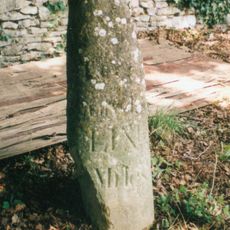 Milestone, by Church, on lane by Bletchingdon Park, in front of wall around church