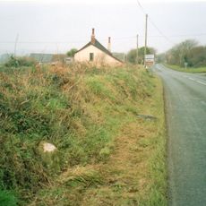 Milestone, near Quoit; 50m E of turning