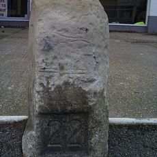 Milestone, Station Road, by No.6 Oakwood Mews (new flats)