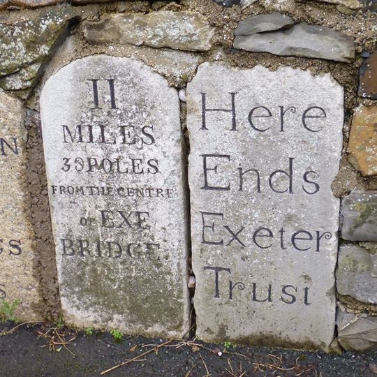 3 Adjacent Roadside Milestones Set In Middle Of Stone Wall Approx 18M West Of Lambert Lane Junction