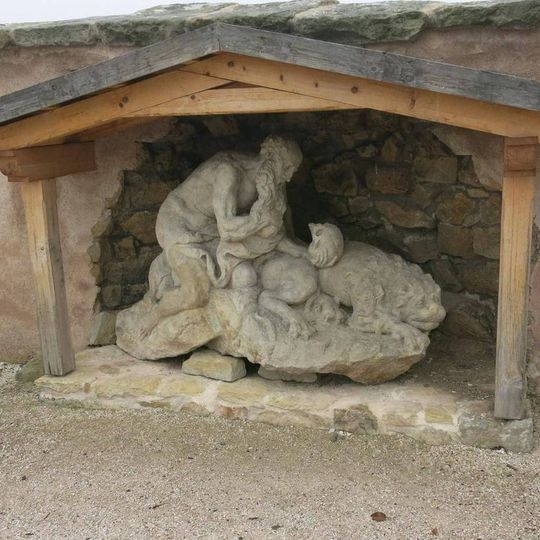 Socha svatého Jeronýma u zdi zahrady špitálu v Kuksu