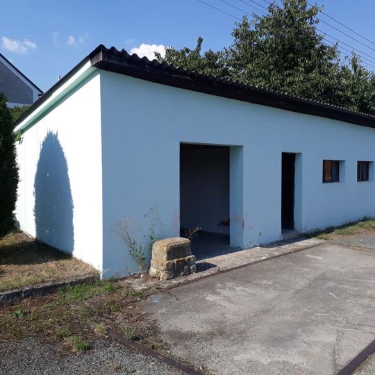 Kříž v Kopidlu na návsi