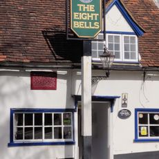 Signpost On Pavement In Front Of Number 2 (The Eight Bells Public House)