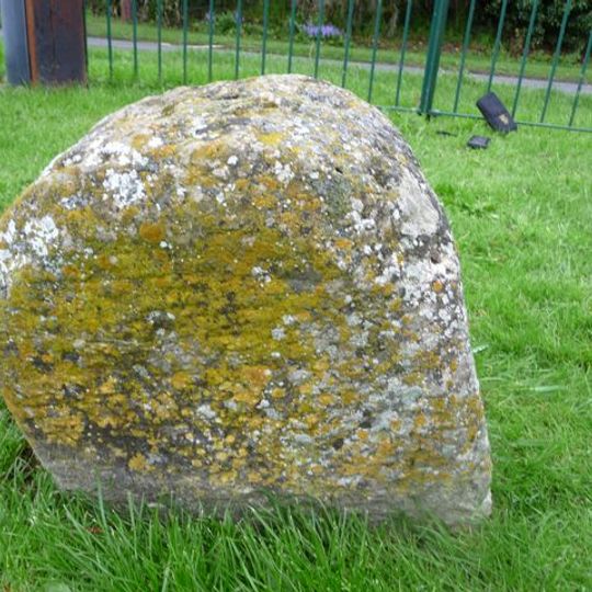 Milestone, S end of village 30m E of sharp bend, by village Hall