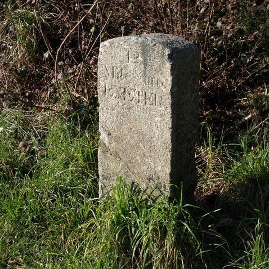 Milestone, the hill half mile N of roundabout in parking bay on Exeter-bound carriageway