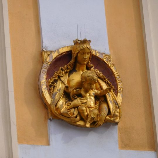 Relief of Madonna with child at Old Town Square 24
