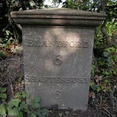 Milepost, S of village, 50m S of 30mph signs