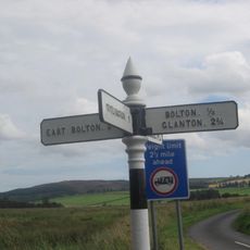 Guide Post East Of Road Junction North East Of Bolton Village