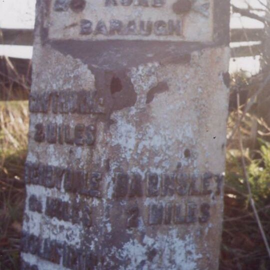 Milestone, third of a mile west of TI jct of A635/A637