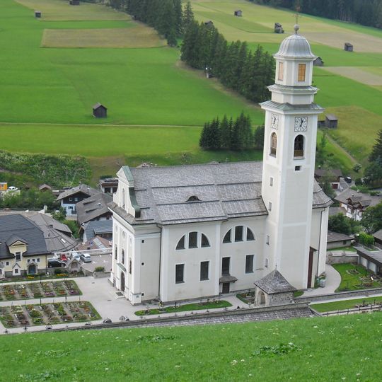 Parish Church St. Peter and Paul with cemetery chapel and cemetery in Sexten