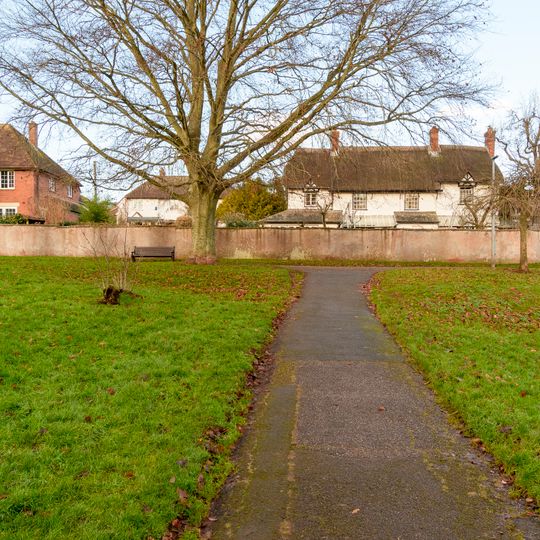 White Cottage And Attached Garden Wall And Stable