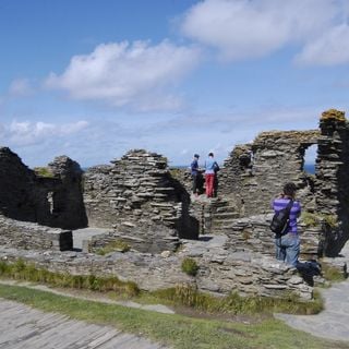 Romano-British and early medieval settlement, medieval church, castle and associated features on Tintagel Island and adjoining m