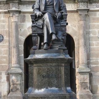 Statue of Charles Darwin in Front of Library