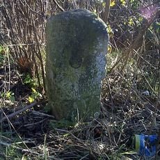 Milestone, High Road, opp jct with Bury Lane (B182)