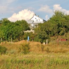 Sculpture in honor of saving daughter of local gentleman from wolves