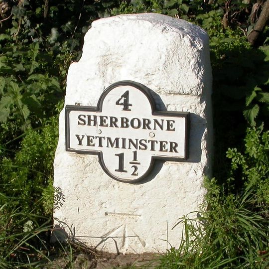 Milestone, W of village, opposite Eagle Mead Goat farm