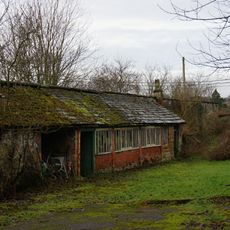 Kitchen garden walls with attached potting sheds at The Brooklands