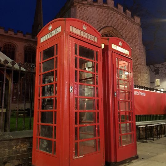 Pair Of K6 Telephone Kiosks Outside Holy Trinity War Memorial Shelter