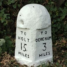Milestone, opp. Gravel Pit House, S of juct