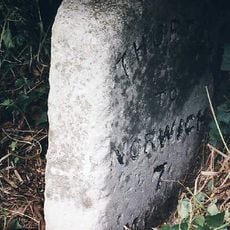 Milestone, 55yds E of end of cul-de-sac (old road)