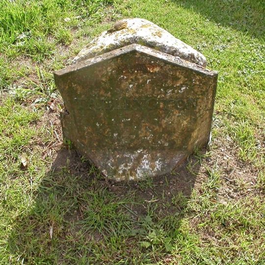 Milestone On West Side Of Village