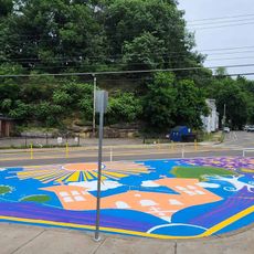 Bikes and Books asphalt art mural