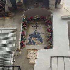 Ceramic panel of Our Lady of the Sorrows at 1-3 Dolors street