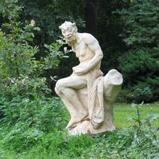 Plastika vodníka u rybníka v Libochovičkách