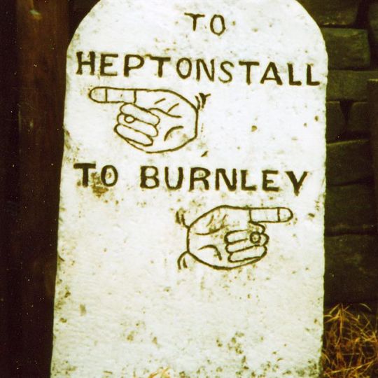 Guide post 5 metres to west of Number 31 Edge Hey Green