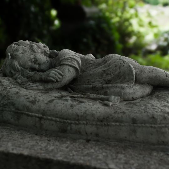 Sculpture of a baby sleeping on a pillow