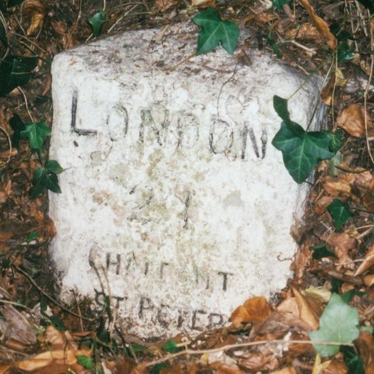 Milestone, Gravel Hill; 50m S of jct with Copthall Lane, beside drive to Azania