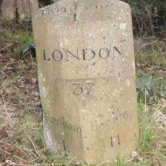 Milestone, Section of the old road, in a cul-de sac opp. entrance to Brodrick Farmhouse, NW sector of Six Bells roundabout