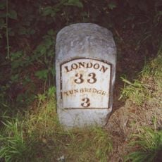 Milestone, N end of village green, opp. jct with Church Road, nr college and school
