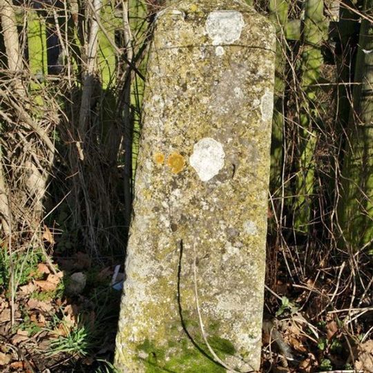 Milestone, by gate to avenue