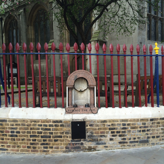 Railings and dwarf wall to churchyard of Church of St Sepulchre