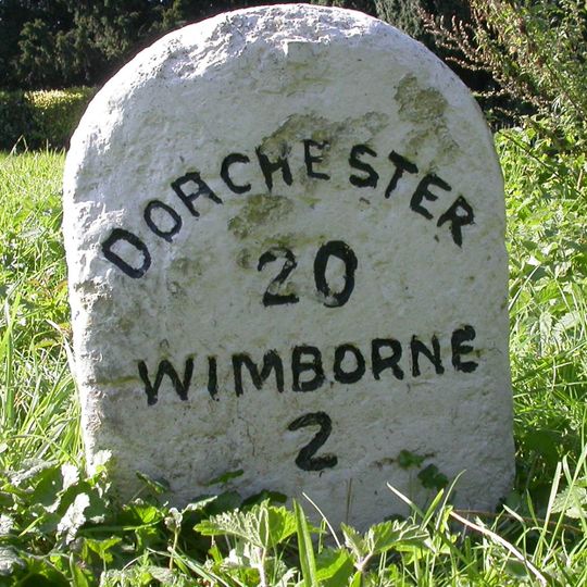Milestone, grass area opp. St Huberts church