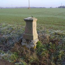 Kříž u silnice z Rybňan do Zálužic