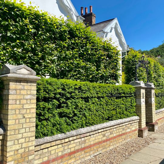 Garden Wall And Gateway With Overthrow To Wildwood Lodge