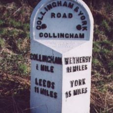 Milestone, about 250m N of A659 jct