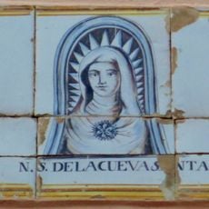 Ceramic panel of Our Lady of Cueva Santa at Árbol square
