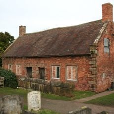 Almhouses in St Mary's churchyard north of the church
