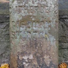 Milestone, Sawley Road, by Christ Church wall