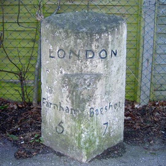 Milestone, Farnborough Road,  opp airfield, between Guildford Road jct and Cross Street jct
